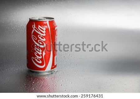 SABAH, MALAYSIA - March 08, 2015: Classic Coca-Cola Can on metal background.
