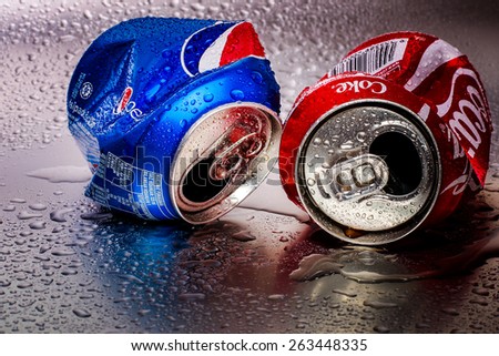 SABAH, MALAYSIA - March 18, 2015: Coca-Cola and Pepsi cans on metal background.