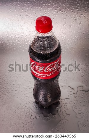 SABAH, MALAYSIA - March 18, 2015: Coca-Cola bottle on metal background.