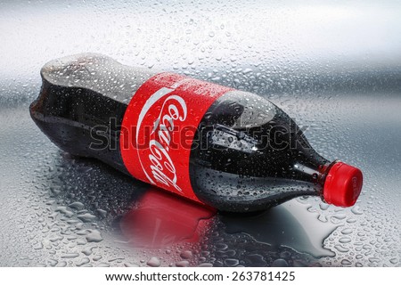 SABAH, MALAYSIA - March 18, 2015: Coca Cola bottle with metal background in wet and cold conditions