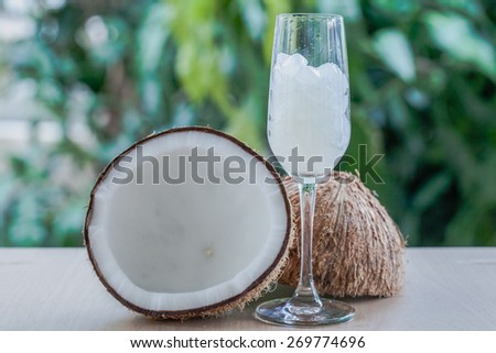 Nata de coco in the glass with blurred effect a garden, healthy food fermentation. Image corresponding to the product by nata de coco, such as food and beverage
