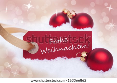 A Red Tag With The German Words Frohe Weihnachten Which Means Merry