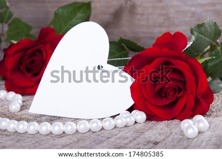 Empty Label in Heart Shape with Roses as Background