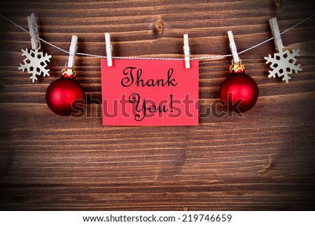 Christmas or Winter Background with a Red Label with the Words Thank You on a Line