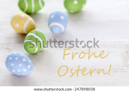 Blue Green And Yellow Easter Eggs Which Are Dotted And Striped On Wooden Vintage Background With German Text Frohe Ostern Which Means Happy Easter For Easter Greetings