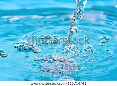 Fresh clean water being poured into a pool