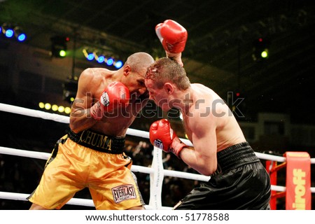 KIEV, UKRAINE - APRIL 19: WBA welterweight belt holder Yuriy Nuzhnenko(R) throws a punch against Irving Garcia during their WBA World Welterweight Title fight on April 19, 2008 in Kyiv, Ukraine