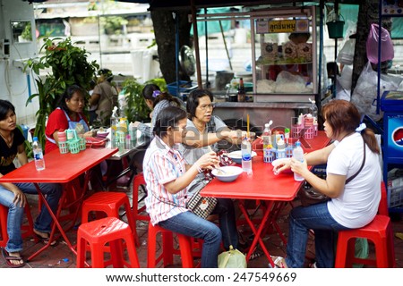 BANGKOK, THAILAND - MARCH 27, 2012: Unidentified people at traditional thailand street fast food restaurant in Bangkok
