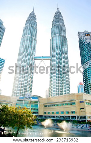 KUALA LUMPUR, MALAYSIA - MAY 12, 2013: View of The Petronas Twin Towers in Kuala Lumpur. Petronas Twin Towers are the tallest twin buildings in the world (451.9 m)