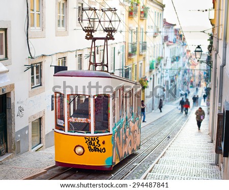 LISBON, PORTUGAL - JAN 15, 2015: Famous retro designed funicular in the Old Town street of Lisbon, Portugal