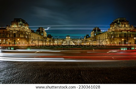 PARIS, FRANCE - NOV 8, 2012: View of the Louvre Pyramid and Pavillon Richelieu in the evening, The pyramid serves as the main entrance to the Louvre Museum