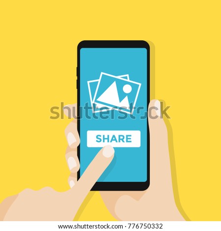 Hand holds smartphone with photos icon on smartphone screen. Multimedia, share photo album app concept. 