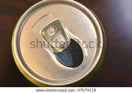 open metal can of beer photo above on a dark background