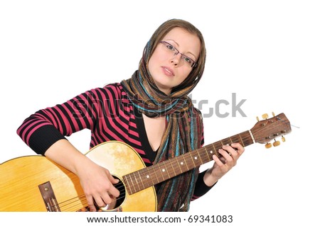 A girl plays a sad tune on the six-string guitar