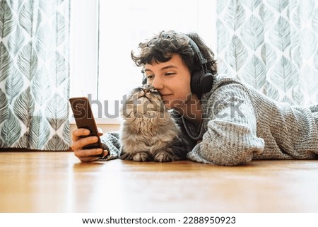 Similar – Image, Stock Photo Young woman hugging cat in hallway