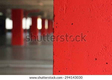 concrete columns of red . soft focus