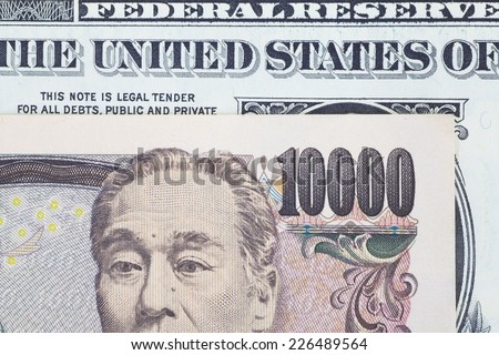 Close - up Japanese bank note and dollar bank note
