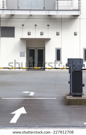 Automatic barrier machine at entrance to building carpark