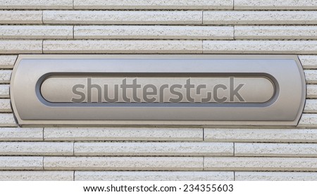 Sliver letterbox or mailbox and modern concrete wall at house