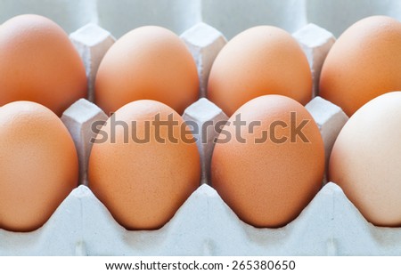 Healthy food brown chicken egg in carton container