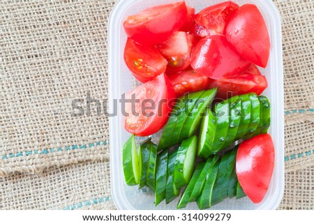 Slice cucumber  and slice tomato in plastic lunch box