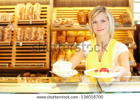 Bakery shopkeeper preparing coffee and cake for customer