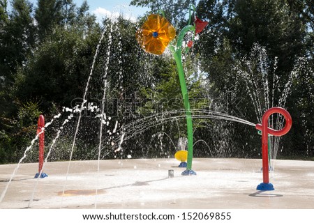 Water garden with trick fountains at public swimming pool