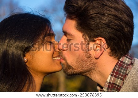 Girlfriend and Boyfriend  in love kissing outside