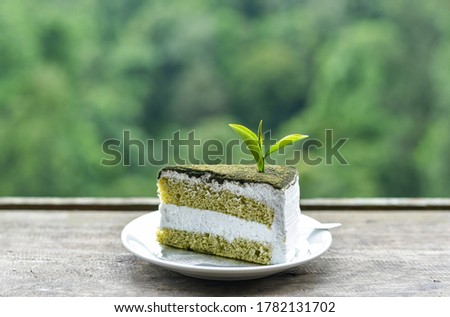 a pice of green tea cake on natural Photo stock © 