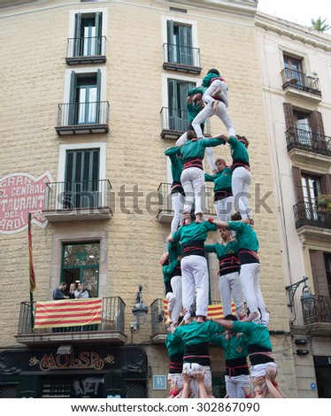 Human tower - typical street performance in Barcelona, Spain - March 22, 2015