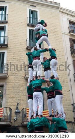 Human tower - typical street performance in Barcelona, Spain - March 22, 2015