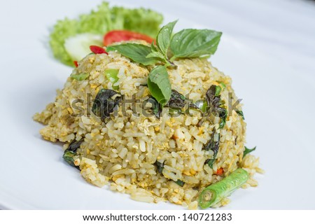close up fried rice with green curry with chicken, Thai food on white dish