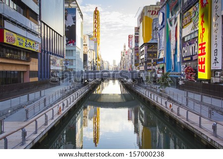 OSAKA, JAPAN - DECEMBER 1 : Japanese people wander in Dotonbori area of Osaka after work on December 1 2012. Dotonbori is an entertainment area of Osaka famous for its neon signs.