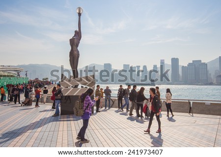 HONG KONG , CHINA - DEC 22 : Travelers visiting the Avenue of the Stars on December 22, 2014 in Hong Kong. The Avenue of Stars is located along the Victoria Harbor in Hong Kong.