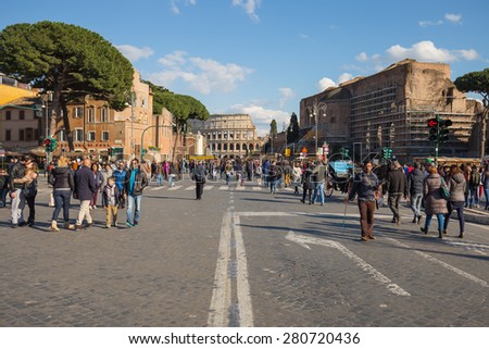 Rome, Italy - April 6, 2015: The crowd of people are hanging out on the road to colosseum in Rome, Italy.