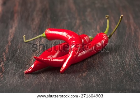 red chilly peppers  on a wooden table