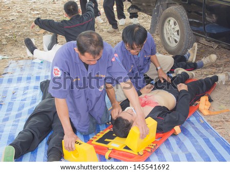 PHRAE,THAILAND - DECEMBER 20 : Unidentified  men are first aid training from staff  the hospital on  December 20, 2012 at local parks, Muang, Phrae, Thailand.