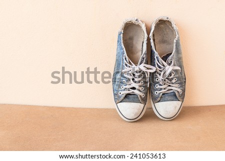 Old shoes on a wood background