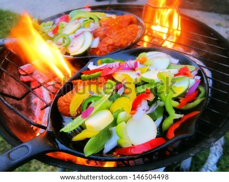 Sizzling healthy fajita chicken beef pork and veggie dinner barbecue grill cookout on a plate