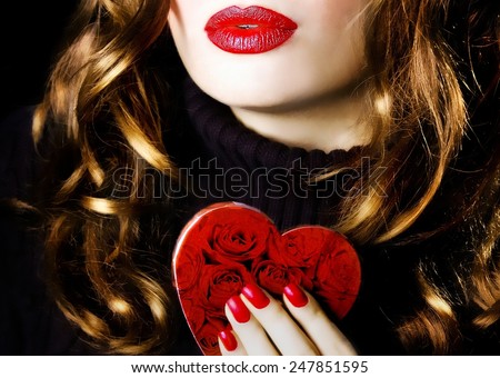 Young beautiful sexy pretty woman holding a red heart makeup valentine love romance