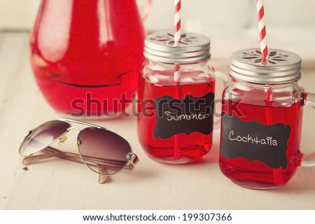 Red lemonade mason jars with jug and blank label to add text