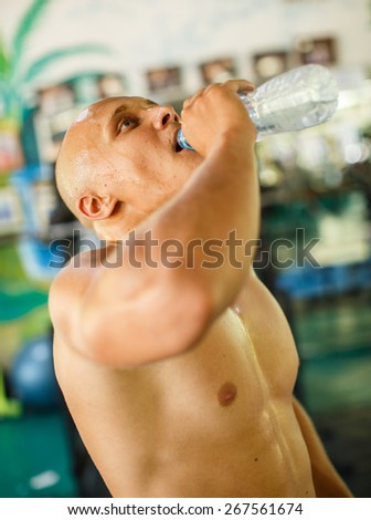 Man drinks water after exercise