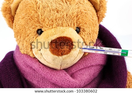 a plush bear with a thermometer in your mouth. representative photo of chills, fever and flu