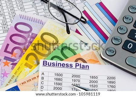 a business plan for starting a business. ideas and strategies for self-employment. euro bank notes and calculator