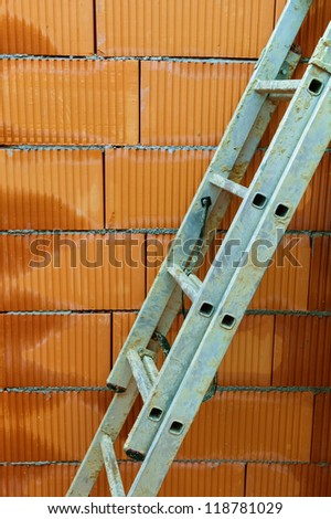 the shell of a house in solid brick construction. construction site for construction.