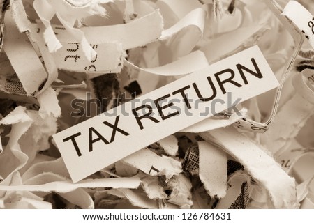 of paper with the heading tax return, symbol photo for data destruction policy and tax law
