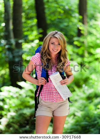 Young Woman Hiking in the recreation in the forest