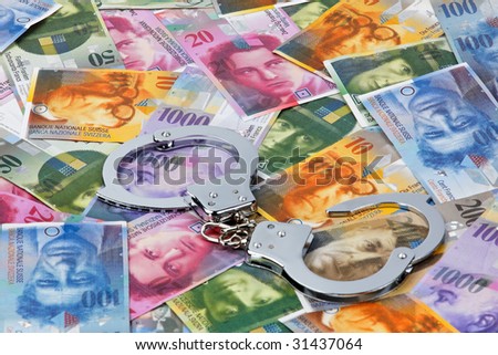 Swiss Franc (money of Switzerland) with handcuffs