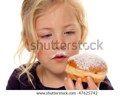 Children in carnival with donuts. Faschingskrapfen