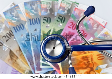 Swiss francs and stethoscope, symbol, health costs